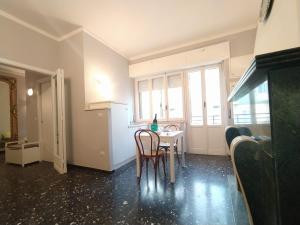 a kitchen with a table and chairs and a window at Antichi Riflessi suite in Cagliari +34 photos
