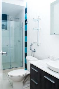 a bathroom with a toilet and a glass shower at 3A - 4BR Apartment ! in Panama City