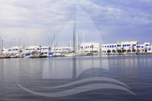 a view of a marina with boats in the water at Marina Cap Monastir- Appart'Hôtel in Monastir