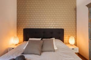 Een bed of bedden in een kamer bij Casa Riad met Privé Patio