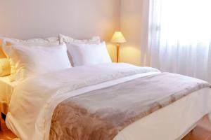 Cama ou camas em um quarto em Zur Suítes