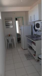 Η κουζίνα ή μικρή κουζίνα στο Residencial Passárgada