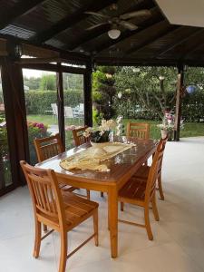 a wooden table and chairs on a patio at Villa Elegance in Kocaeli