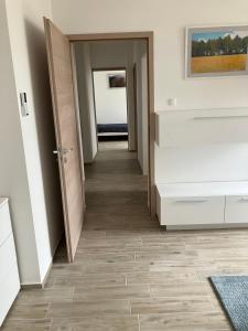 Postel nebo postele na pokoji v ubytování Primo Apartman + 5 fotografií