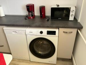 Kuchyň nebo kuchyňský kout v ubytování Primo Apartman