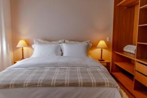 Cama ou camas em um quarto em Zur Suítes