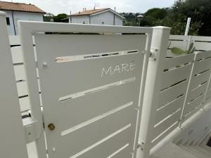 a white garage door with the words where on it at Appartamento Mare in Numana