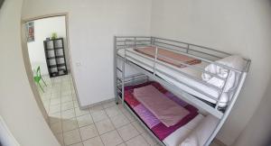 a room with two bunk beds in a room at Gîte Soleil in Adissan
