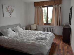 Postel nebo postele na pokoji v ubytování Auberge de l'Ours
