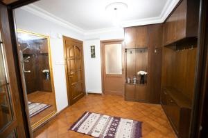 a hallway with wooden cabinets and a door at 3 Diffrent Family Apartments At Center Walking 5 Minutes in Istanbul +64 photos