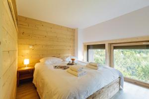 Posteľ alebo postele v izbe v ubytovaní Résidence Grand Roc - Ancolies 216 - Happy Rentals