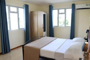 Postel nebo postele na pokoji v ubytování Panoramic Seaview suite