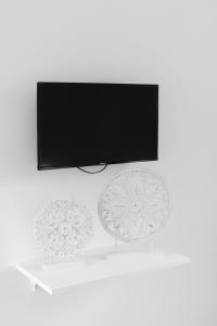 TV a/nebo společenská místnost v ubytování San Giuseppe Relais