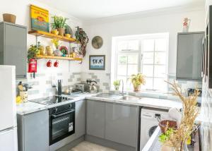 a kitchen with a sink and a dishwasher at #03 The Haw thornes Sleeps 6 NEC 7mins in Coleshill