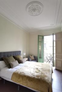 מיטה או מיטות בחדר ב-Casa Luxe Suites Barcelona