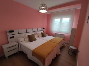 Postel nebo postele na pokoji v ubytování Casa Abuela Inés