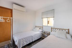 Posteľ alebo postele v izbe v ubytovaní atico primera linea de playa
