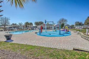 a playground in a park with a pool at 1 Mi to Beach and Hot Tub Murrells Inlet Retreat! in Myrtle Beach
