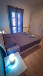 a bedroom with a large bed and a table at A casa di Adriana in Perugia +5 photos