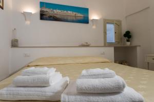 Postel nebo postele na pokoji v ubytování Sotto il Campanile