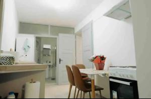 a kitchen with a table and chairs and a counter at Old town luxury segment in Braşov