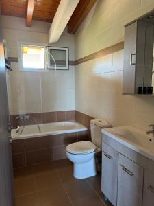 a bathroom with a toilet and a tub and a sink at Endless Seaview Apartment A in Alykes +30 photos