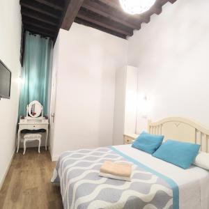 Posteľ alebo postele v izbe v ubytovaní Apartamento Tres Culturas