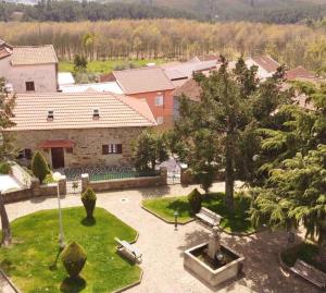 an aerial view of a house with a park with a fountain at Pure Mountain - Serra da Estrela in Erada +35 photos