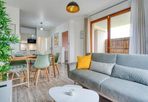 a living room with a couch and a table at Bella Notte in Montévrain +15 photos