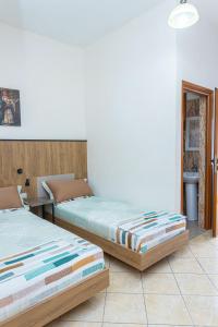 Postel nebo postele na pokoji v ubytování Hotel Olti