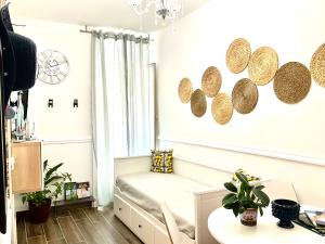 a living room with a couch and a table at Mizzicahome SoleMare Catania in Catania