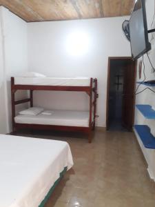 Hotel Zona Libre Capurganá - Cerca a la playa y el muelle客房内的一张或多张床位