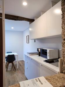 Kuchyň nebo kuchyňský kout v ubytování DOMI Suites & Studios + 22 fotografií