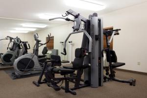 a gym with several exercise equipment in a room at Candlewood Suites New Iberia by IHG in New Iberia