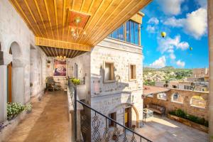 A balcony or terrace at Cappadocia Pegasos Cave Suite Hotel