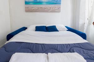 Posteľ alebo postele v izbe v ubytovaní San Siro Suite SS1 Sanremo centro a due passi dal mare