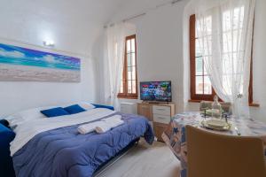 Posteľ alebo postele v izbe v ubytovaní San Siro Suite SS1 Sanremo centro a due passi dal mare