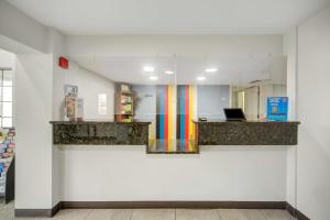 a room with a counter with a rainbow on the wall at Motel 6 San Antonio, TX I-35 North Corridor in San Antonio
