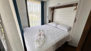 Postel nebo postele na pokoji v ubytování Flu Alaçatı Tiny House Otel