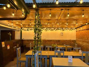 a restaurant with tables and chairs and lights at Hotel Casa Blanca Antigua Guatemala in Antigua Guatemala +46 photos