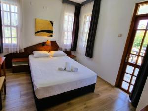 Postel nebo postele na pokoji v ubytování Şima Hotel Kemer