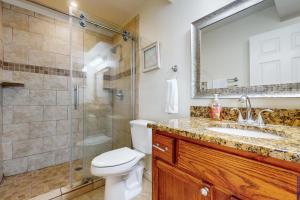 a bathroom with a toilet and a shower and a sink at Fortuna Sea Brisas Condominiums #4 in Corpus Christi +18 photos