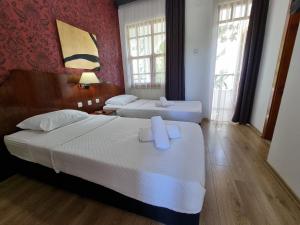 Postel nebo postele na pokoji v ubytování Şima Hotel Kemer