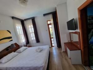 Postel nebo postele na pokoji v ubytování Şima Hotel Kemer