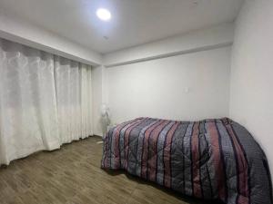 En eller flere senge i et værelse på Comodidad en un solo lugar