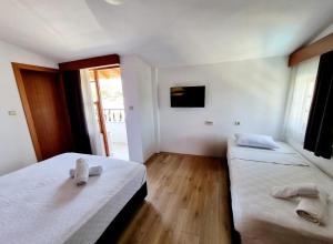 Postel nebo postele na pokoji v ubytování Şima Hotel Kemer