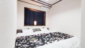 Voodi või voodid majutusasutuse 京輪家-KyorinYa- toas