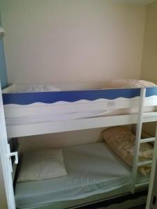 Ένα ή περισσότερα κρεβάτια σε δωμάτιο στο Appartement Les Sables Blancs