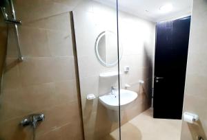 a bathroom with a sink and a shower with a mirror at Aldau Sunset in Hurghada +67 photos