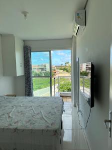 TV a/nebo společenská místnost v ubytování Kite Village Cumbuco